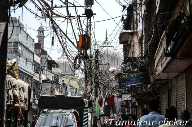 The wires tell a story of modernisation... with the Jama Masjid in the background
